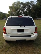PAMPERED VERYWELL KEPT SNOW WHITE LOW MILEAGE 2002 GRAND CHEROKEE LIMITED image 1