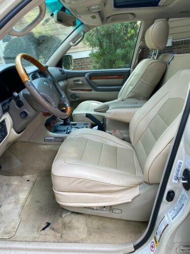 Loaded champagne exterior and tan leather interior.No rust; custom seat covers image 4
