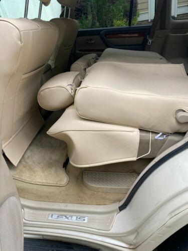 Loaded champagne exterior and tan leather interior.No rust; custom seat covers image 5