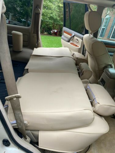 Loaded champagne exterior and tan leather interior.No rust; custom seat covers image 6