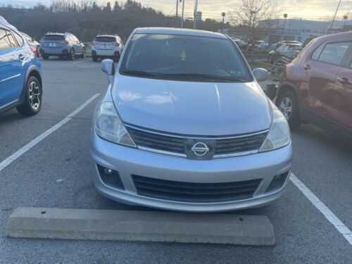Brilliant Silver Metallic Nissan Versa with 92522 Miles available now! image 1