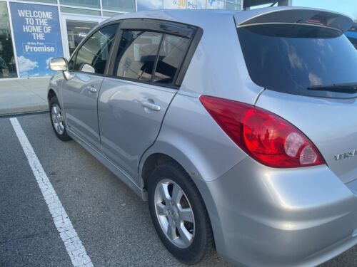 Brilliant Silver Metallic Nissan Versa with 92522 Miles available now! image 8