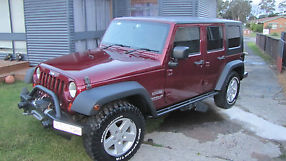 Jeep Wrangler Unlimited Sport (4x4) (2009) 4D Hard top 4 SP Automatic (3.8L -... image 1