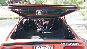 1975 Bricklin, red, daily driver.Custom interior image 4